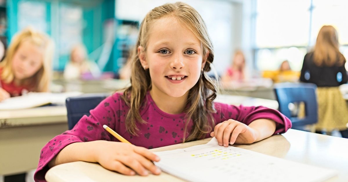 Girl Sitting At Desk With Pencil And Paper | Starting The School Year Off Strong