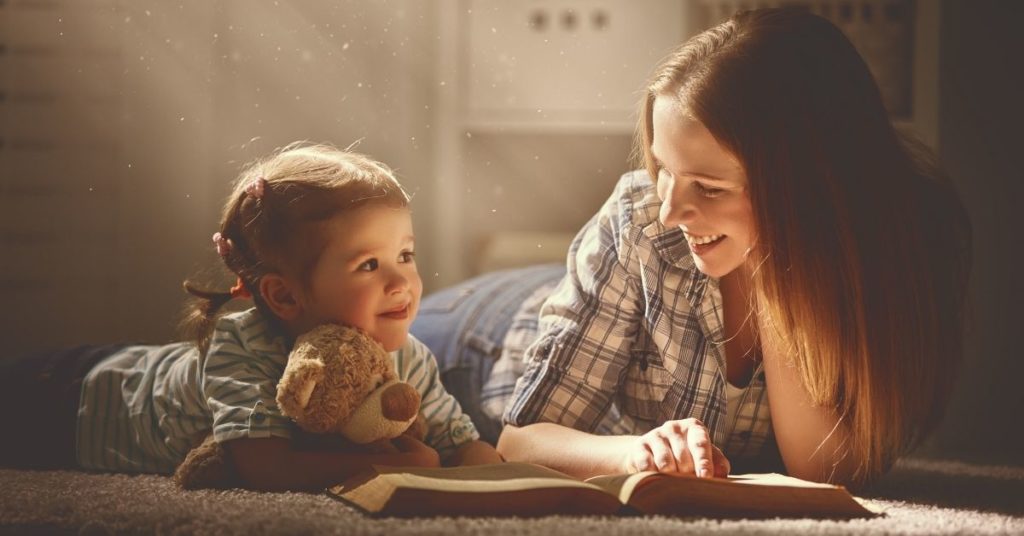 A Woman Reading To A Child | Importance of Reading With Your Child